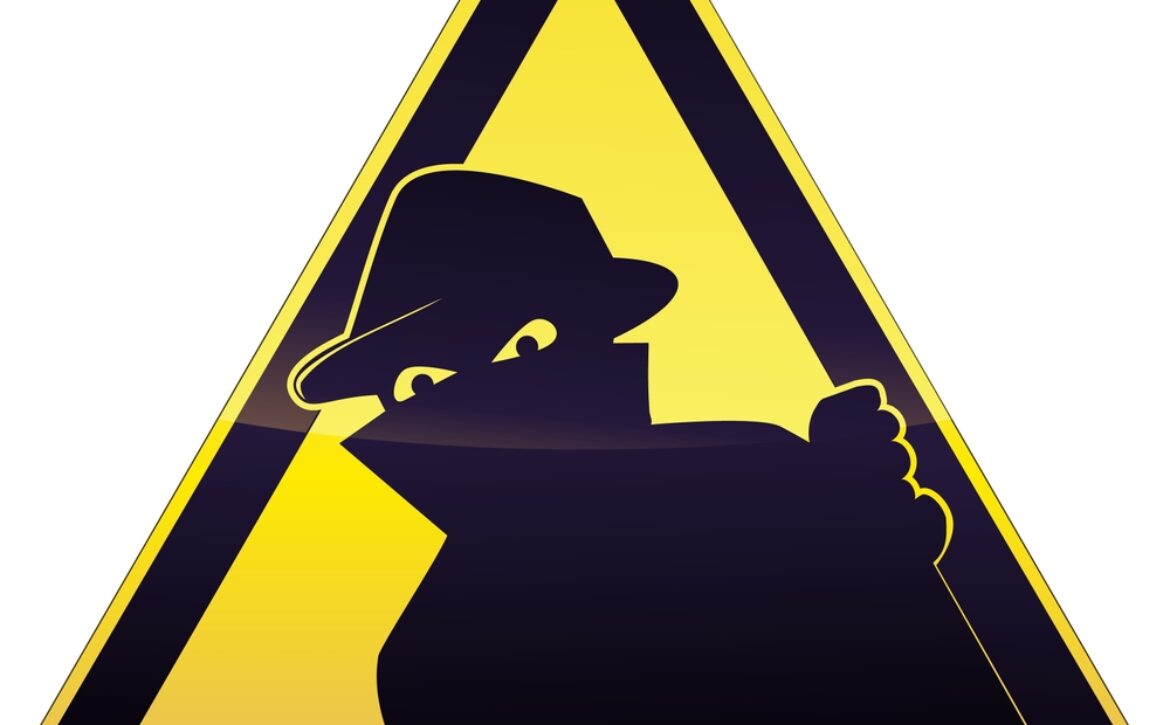 Yellow,And,Black,Triangular,Burglary,Warning,Sign,On,Which,A