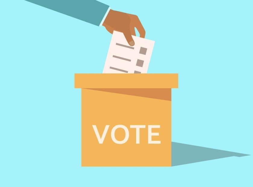 Hand,Throws,A,Ballot,Into,The,Ballot,Box.,Elections,,Voting