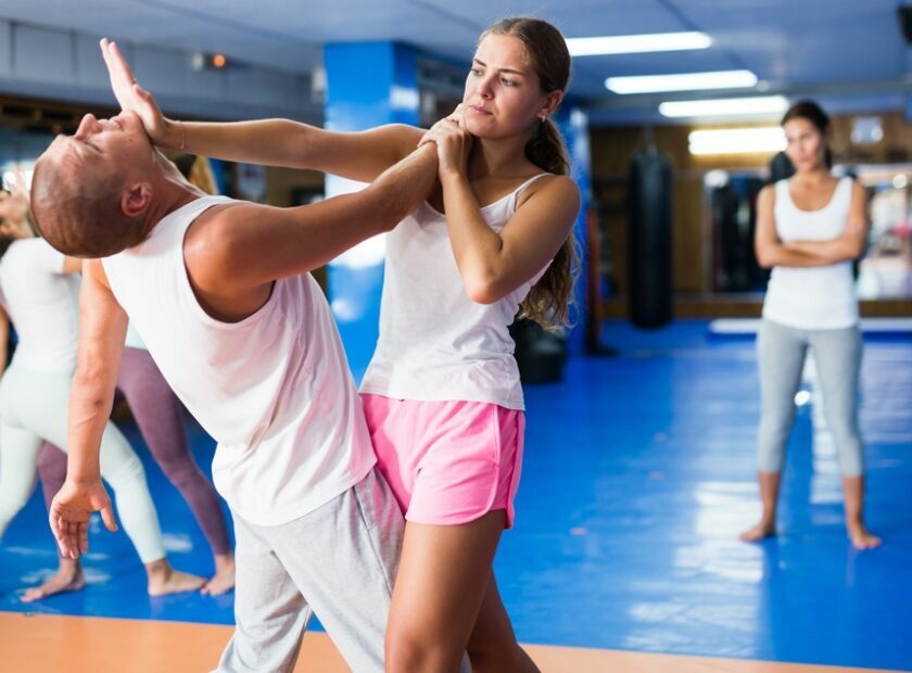 Young,Lady,Doing,Heel,Palm,Chin,Strike,During,Group,Self-defence
